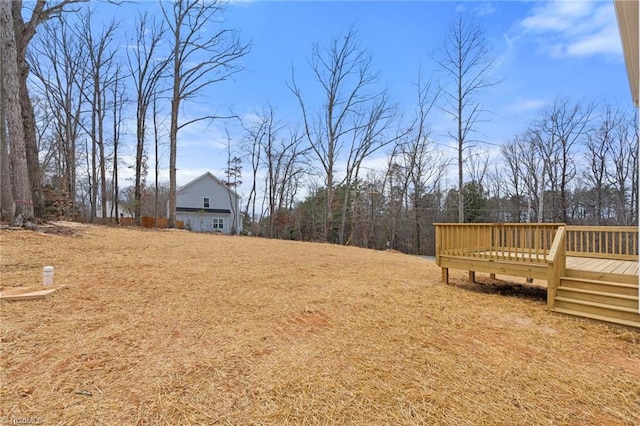 view of yard with a wooden deck