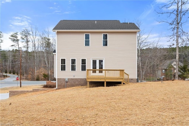 back of house with a deck and french doors