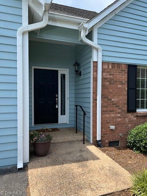 375 Hollybrook Dr, Bermuda Run, NC 27006 - doorway to property featuring crawl space and brick siding