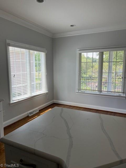 375 Hollybrook Dr, Bermuda Run, NC 27006 - spare room featuring crown molding and dark wood-type flooring