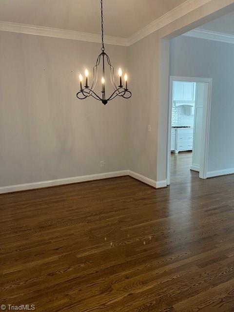 375 Hollybrook Dr, Bermuda Run, NC 27006 - unfurnished dining area featuring a chandelier, dark wood-style floors, and crown molding