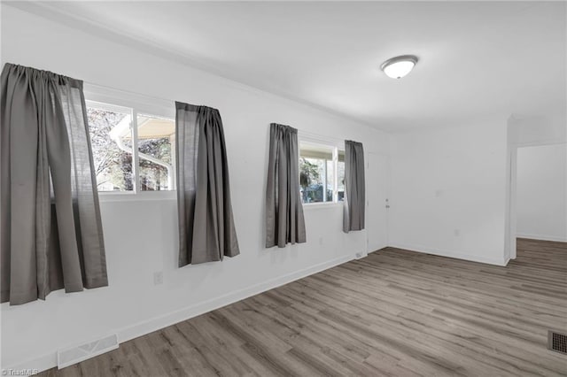 empty room featuring hardwood / wood-style floors