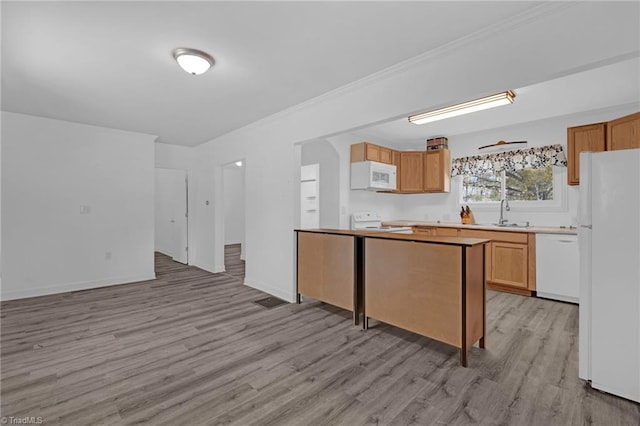 kitchen with crown molding, sink, light hardwood / wood-style floors, and white appliances