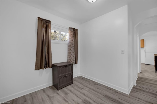 unfurnished room with light wood-type flooring