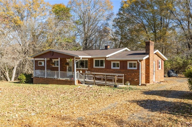 ranch-style house with covered porch