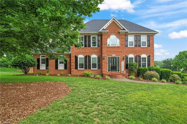 3401 Lochurst Ct, Pfafftown, NC 27040 - georgian-style home featuring a front lawn and brick siding