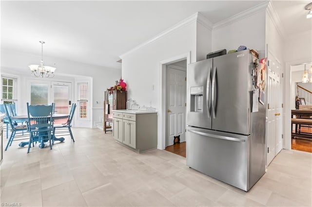 3401 Lochurst Ct, Pfafftown, NC 27040 - kitchen with stainless steel fridge, a chandelier, ornamental molding, plenty of natural light, and light countertops