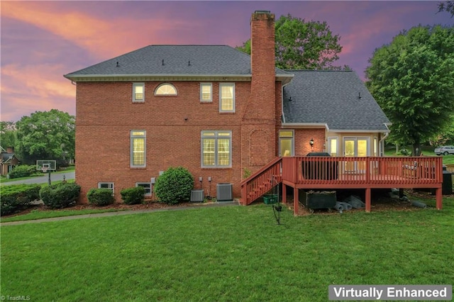 3401 Lochurst Ct, Pfafftown, NC 27040 - back of property with a chimney, a lawn, a deck, central AC, and brick siding
