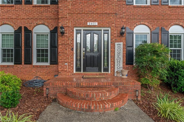 3401 Lochurst Ct, Pfafftown, NC 27040 - view of exterior entry featuring brick siding