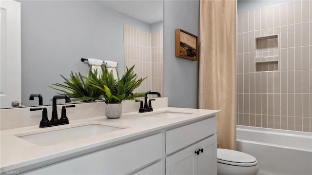 full bathroom with vanity, shower / bathtub combination with curtain, and toilet