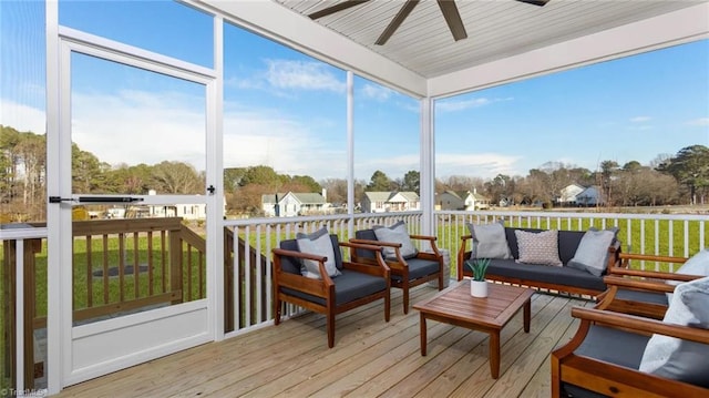 sunroom / solarium with ceiling fan