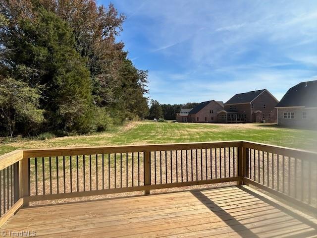 wooden deck with a yard