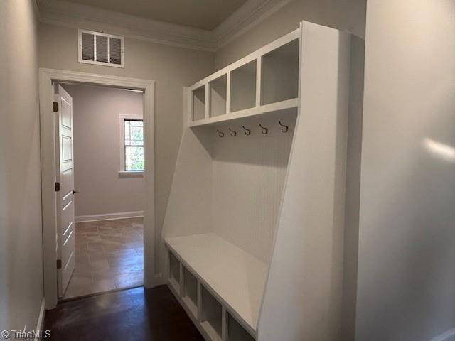 mudroom featuring ornamental molding