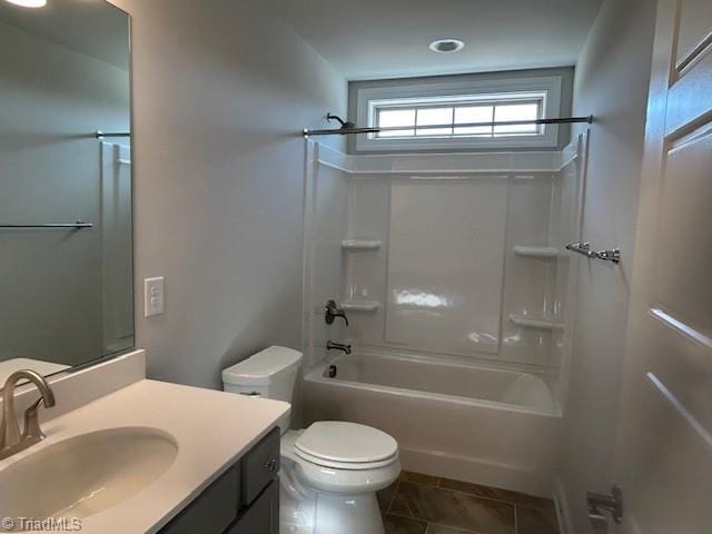 full bathroom with toilet, washtub / shower combination, vanity, and tile patterned floors