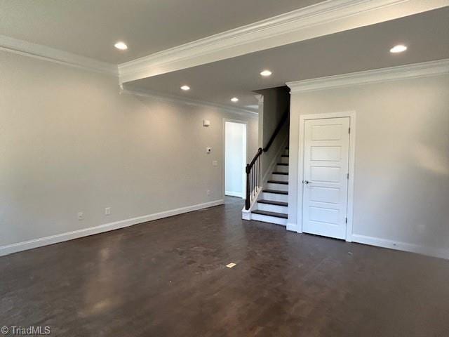 basement with ornamental molding and dark hardwood / wood-style floors