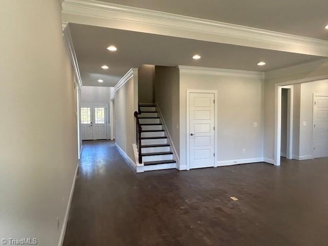 interior space with hardwood / wood-style floors, french doors, and crown molding