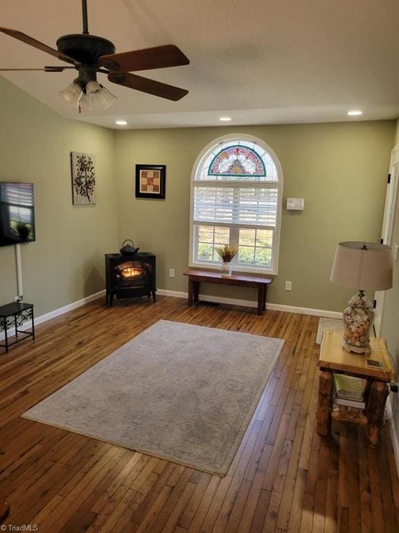 living area with recessed lighting, baseboards, and hardwood / wood-style floors