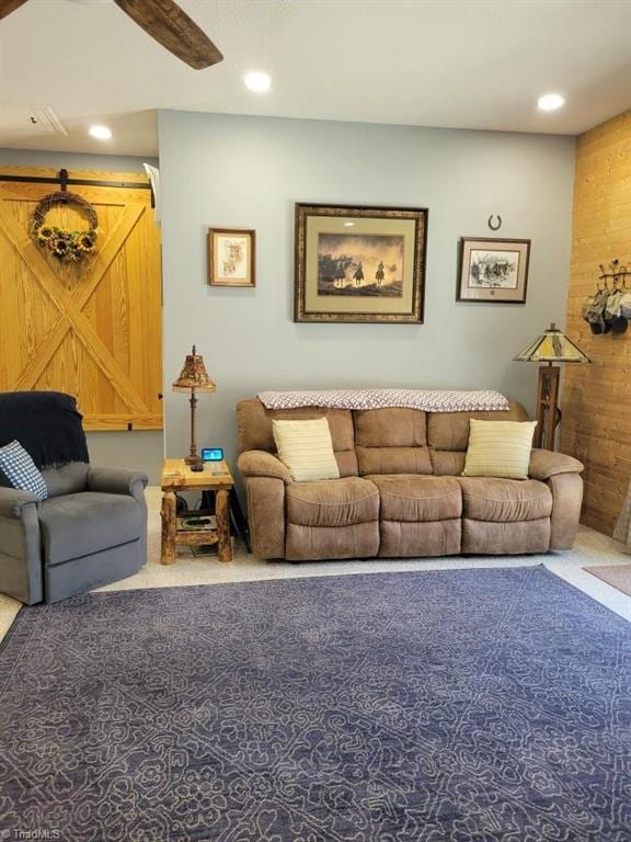 living area featuring carpet and recessed lighting