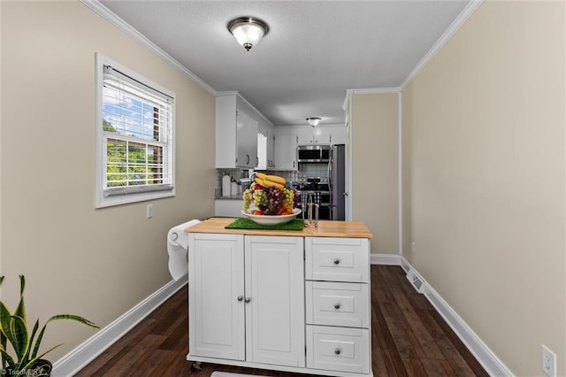 100 Monroe Dr, Lexington, NC 27295 - kitchen featuring dark wood-style flooring, baseboards, white cabinets, tasteful backsplash, and appliances with stainless steel finishes