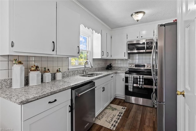100 Monroe Dr, Lexington, NC 27295 - kitchen with a sink, dark wood-style flooring, white cabinetry, and stainless steel appliances