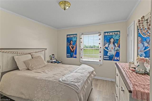 100 Monroe Dr, Lexington, NC 27295 - bedroom with crown molding, baseboards, a textured ceiling, and light wood-style flooring