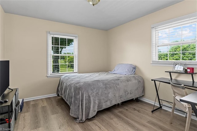 100 Monroe Dr, Lexington, NC 27295 - bedroom featuring baseboards and wood finished floors