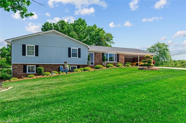 100 Monroe Dr, Lexington, NC 27295 - view of front of house featuring brick siding, a front lawn, driveway, and a carport