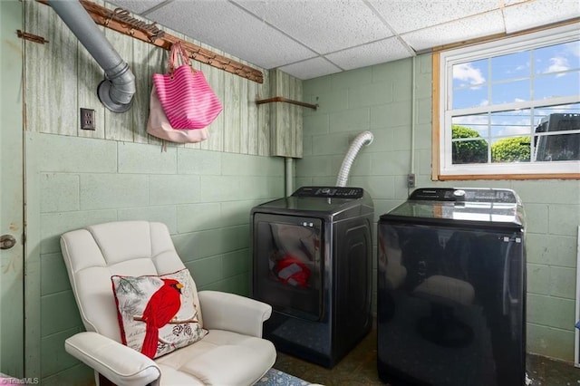 100 Monroe Dr, Lexington, NC 27295 - laundry room featuring concrete block wall, laundry area, and independent washer and dryer