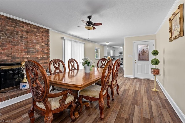 100 Monroe Dr, Lexington, NC 27295 - dining room featuring crown molding, baseboards, ceiling fan, a textured ceiling, and hardwood / wood-style flooring