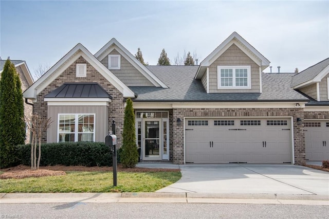 view of front facade with driveway, a shingled roof, a garage, and brick siding