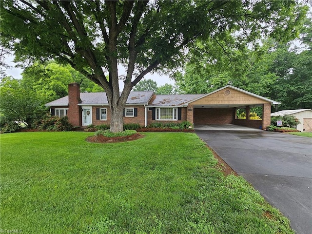 4875 Follansbee Rd, Winston-Salem, NC 27127 - single story home featuring driveway, a front yard, a carport, brick siding, and a chimney