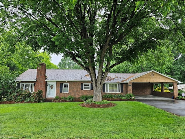 4875 Follansbee Rd, Winston-Salem, NC 27127 - ranch-style house featuring a chimney, a carport, a front lawn, concrete driveway, and brick siding