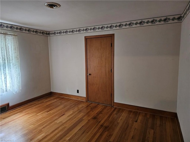 4875 Follansbee Rd, Winston-Salem, NC 27127 - spare room featuring wood finished floors and baseboards