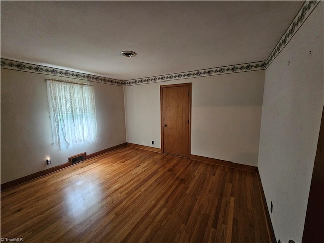 4875 Follansbee Rd, Winston-Salem, NC 27127 - empty room with wood finished floors and baseboards