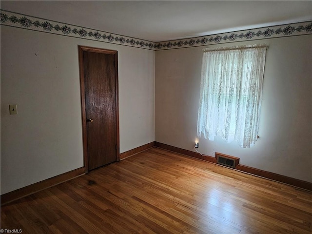 4875 Follansbee Rd, Winston-Salem, NC 27127 - spare room featuring wood finished floors and baseboards