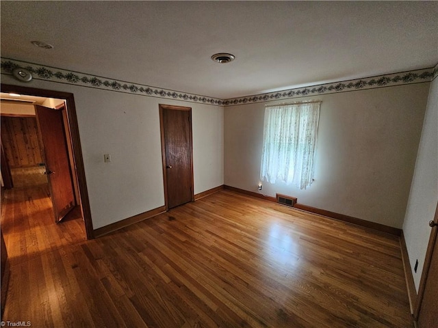 4875 Follansbee Rd, Winston-Salem, NC 27127 - spare room with wood finished floors and baseboards