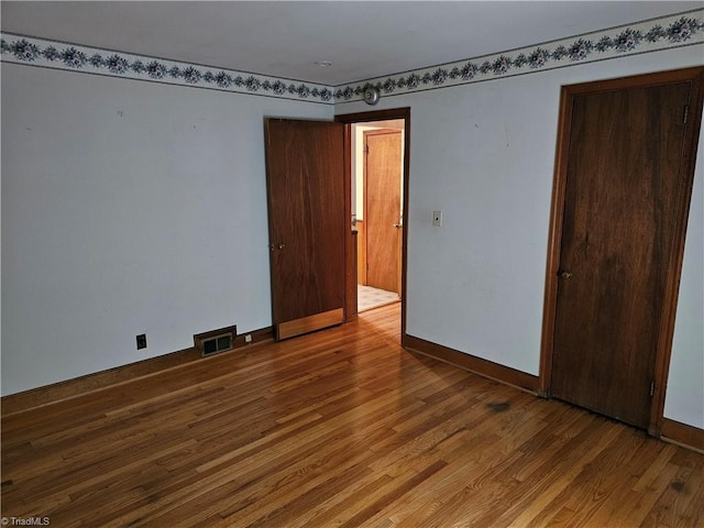 4875 Follansbee Rd, Winston-Salem, NC 27127 - empty room featuring wood finished floors and baseboards