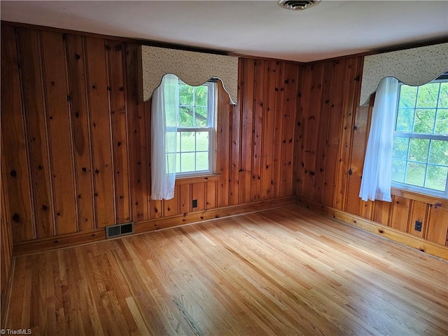 4875 Follansbee Rd, Winston-Salem, NC 27127 - spare room with wood finished floors, baseboards, and wood walls