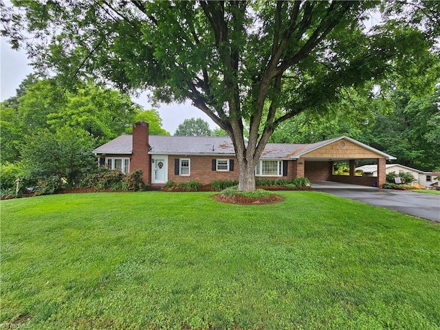 4875 Follansbee Rd, Winston-Salem, NC 27127 - single story home featuring asphalt driveway, a chimney, a carport, a front lawn, and brick siding