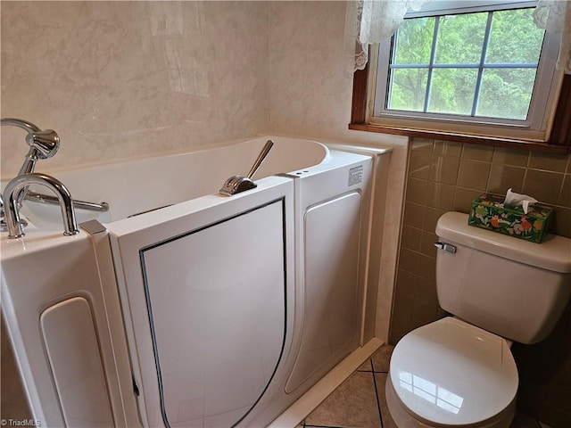 4875 Follansbee Rd, Winston-Salem, NC 27127 - full bath with tile walls, a garden tub, toilet, and tile patterned flooring