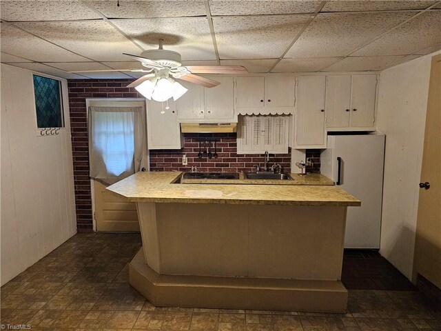 4875 Follansbee Rd, Winston-Salem, NC 27127 - kitchen with a sink, freestanding refrigerator, white cabinetry, light countertops, and ceiling fan