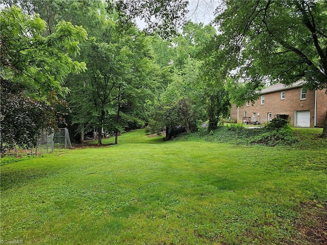 4875 Follansbee Rd, Winston-Salem, NC 27127 - view of grassy yard with an attached garage