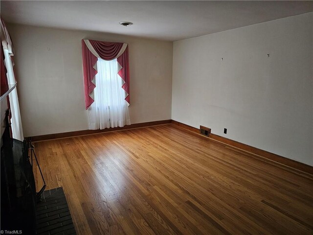 4875 Follansbee Rd, Winston-Salem, NC 27127 - empty room featuring wood finished floors and baseboards