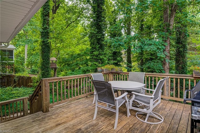 deck with outdoor dining area