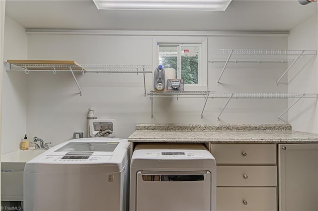 washroom featuring laundry area and independent washer and dryer