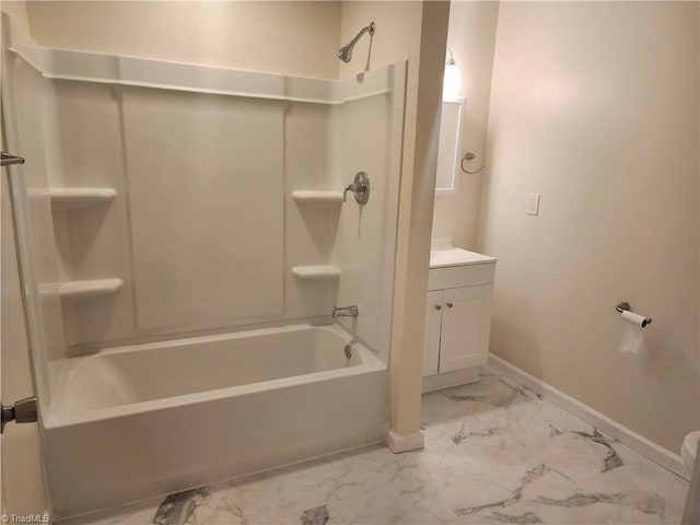 full bath with marble finish floor, baseboards, tub / shower combination, and vanity