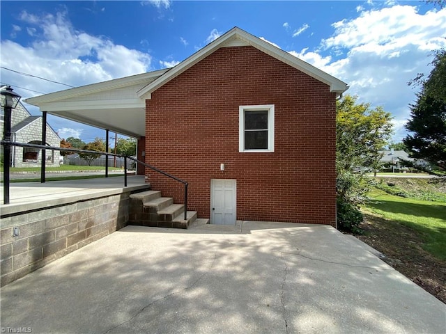 view of property exterior featuring a carport