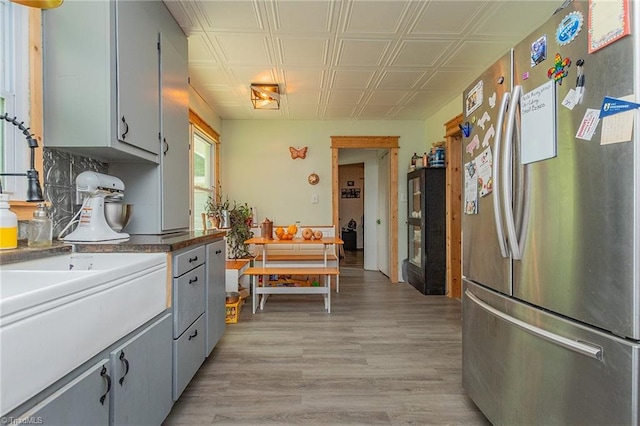 704 Summit Rd, High Point, NC 27265 - kitchen featuring freestanding refrigerator, gray cabinetry, an ornate ceiling, and light wood-style floors