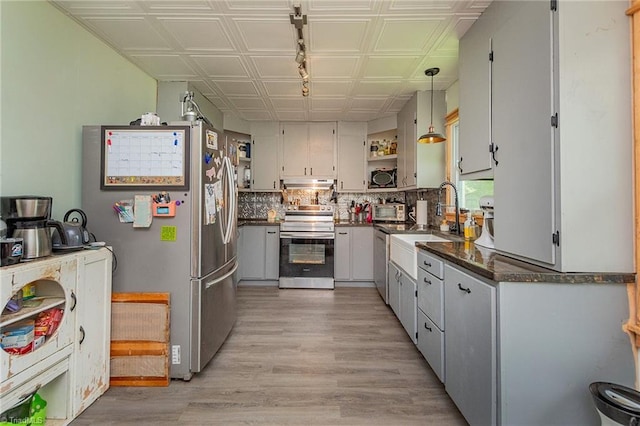 704 Summit Rd, High Point, NC 27265 - kitchen featuring stainless steel appliances, dark countertops, an ornate ceiling, under cabinet range hood, and open shelves