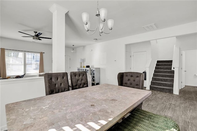 dining space featuring hardwood / wood-style floors and ceiling fan with notable chandelier